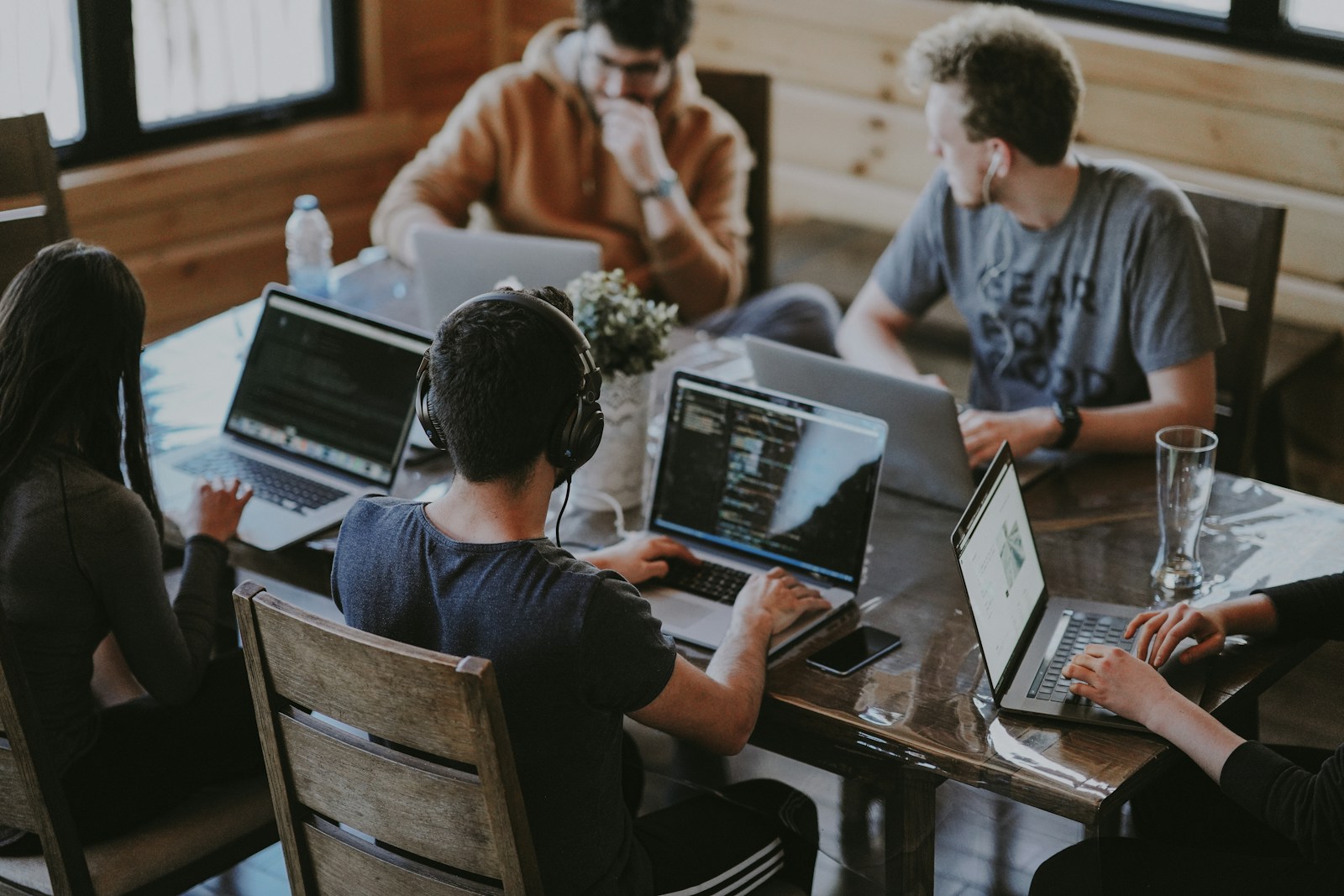 Business team collaborating with laptops in an office